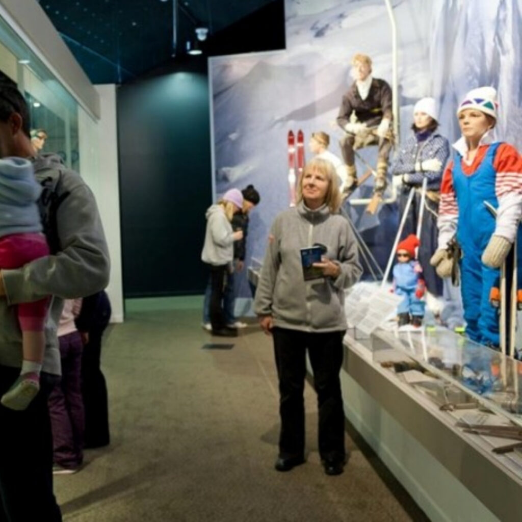 Visitors exploring the New Zealand Alpine & Agriculture Museum with ski history displays.